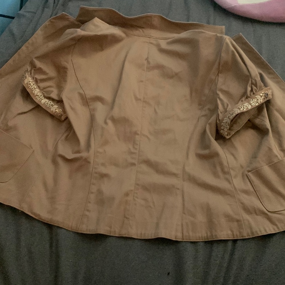 Brown vest.       With buttons